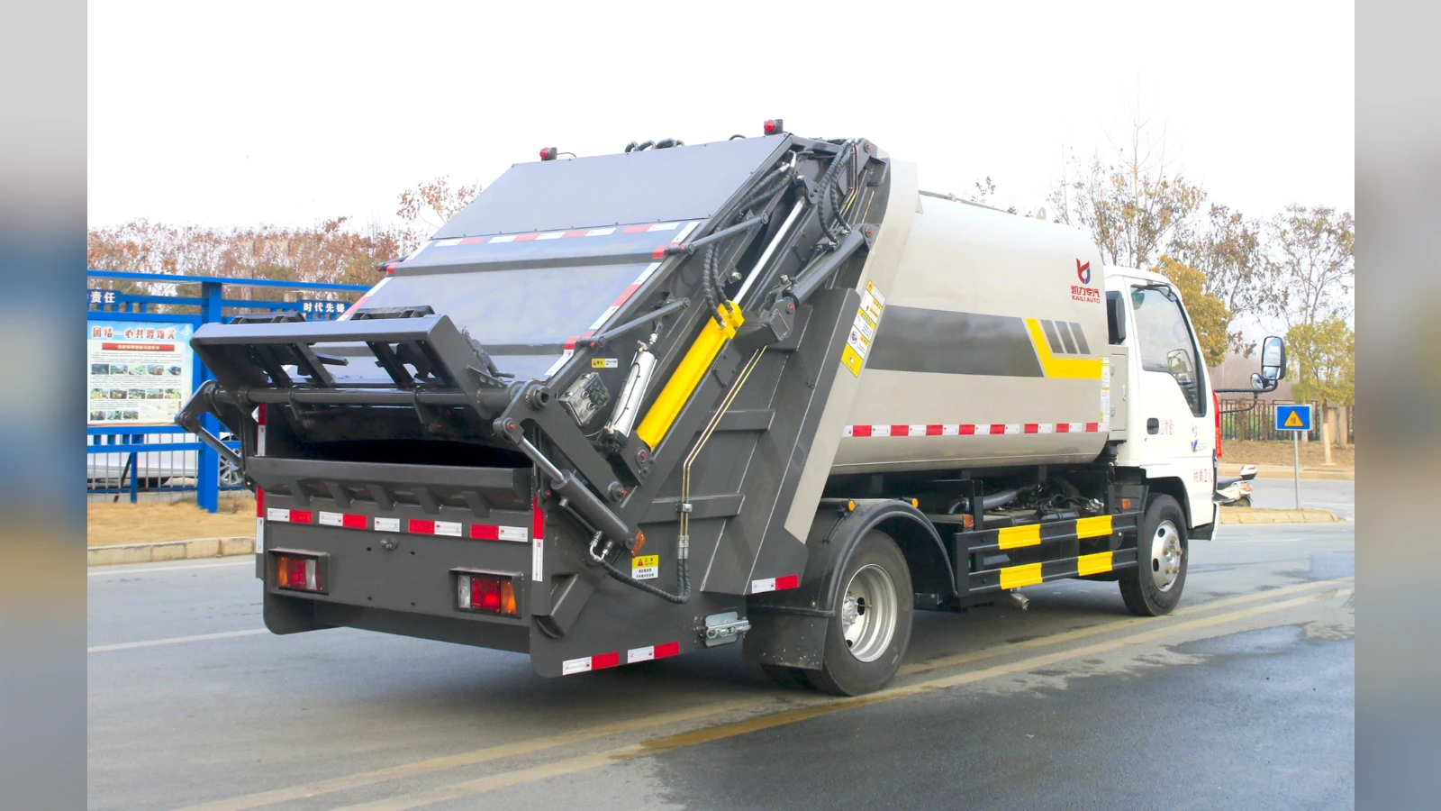 8 m3 compression garbage truck body on the robotic weld line render