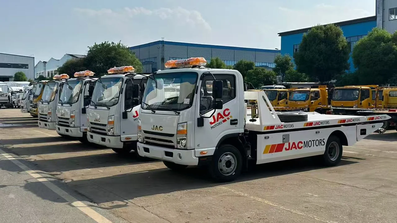 Four JAC Wheel-Lift Flatbed Wreckers, Drawn Up in Formation for Ghana