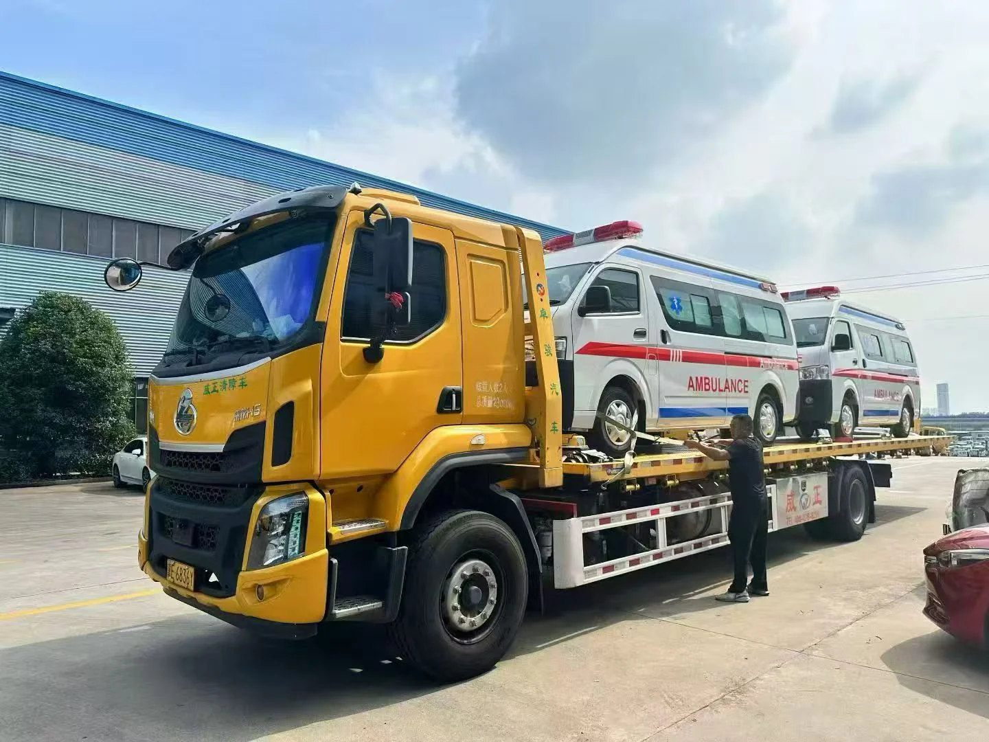 ambulances loaded onto flatbed carrier
