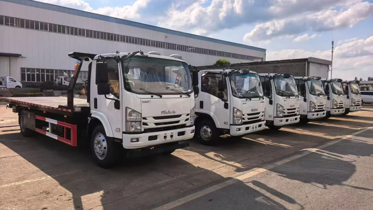 6 Units ISUZU KV100 4 Ton Flatbed Wreckers With Rear Lifting Arm Exported to Uganda for East Africa Road Rescue