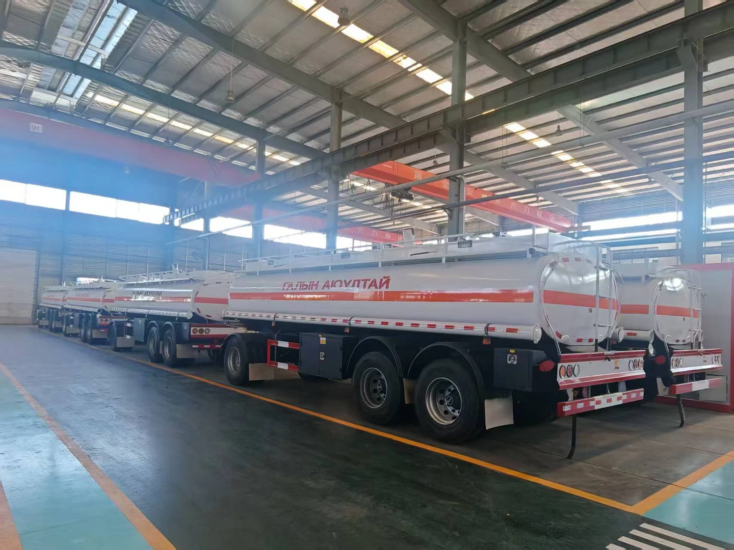 Rear three-quarter view of the staged tank trailers