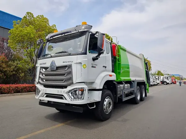 SINOTRUK 6x4 compactor garbage truck built by CLW photographed at the factory